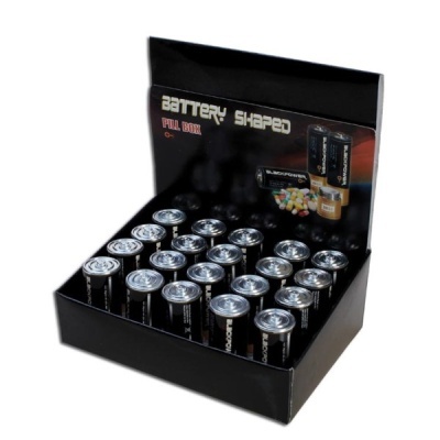 Expositor preto com caixas pequenas em forma de pilha e texto BATTERY SHAPED PILL BOX