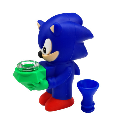 Figura de personagem azul com sapatos vermelhos segurando objeto verde