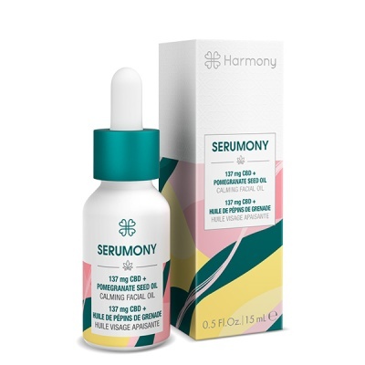 Frasco branco com conta-gotas verde e caixa colorida do óleo facial SERUMONY
