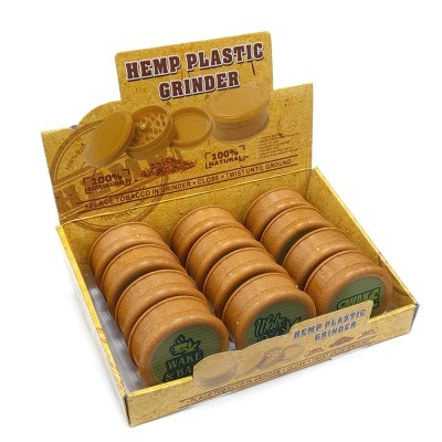 Tritura tabaco de plástico de cânhamo WAKE & BAKE castanho com tampa verde em expositor amarelo