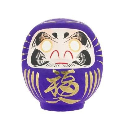 Figura Daruma roxa com detalhes dourados e pretos