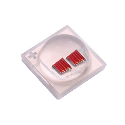 Elemento eletrónico com dois painéis solares vermelhos numa moldura transparente com símbolos + e -.