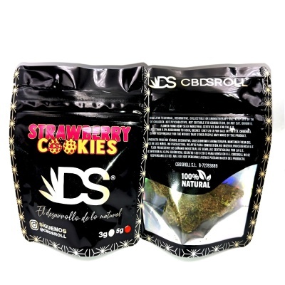 Pacote preto com produto Strawberry Cookies DS, 100% Natural, 3g e 5g, com texto em espanhol e português