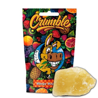 Embalagem colorida com frutas e desenho de burro, texto Crumble Mango Mojito, e pedaço sólido amarelo