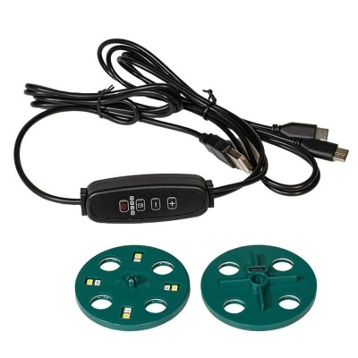 Cabos pretos com controlos e duas bases verdes com LEDs