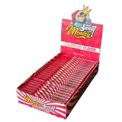Expositor com doces Sweet Monkey sabor morango em embalagens rosa com listras brancas