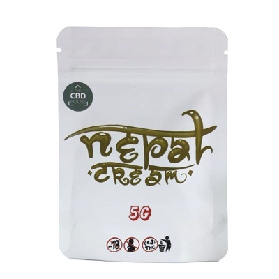 Embala branca Nepal Dream 5g com texto dourado e símbolos de advertência