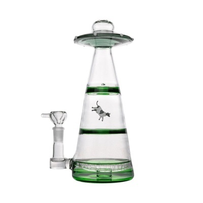 Base de vidro transparente com detalhes verdes e uma figura de vaca