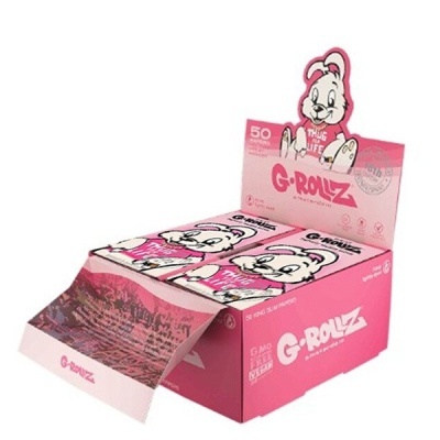 Caixa rosa com embalagens de papel de enrolar G-ROLLZ e desenho de coelho branco
