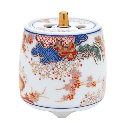 Incensário cerâmico branco com padrão floral colorido e detalhes dourados