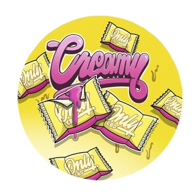 Embalagens amarelas com texto Only CBD e palavra Creamy em roxo num fundo amarelo