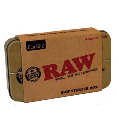 Caixa metálica RAW starter box com embalagem de papel castanho e texto vermelho e preto
