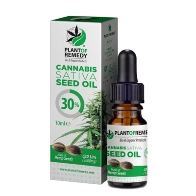 Frasco e embalagem de óleo de sementes de cannabis em fundo branco