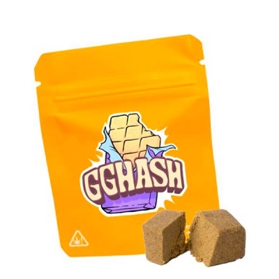 Embalagem amarela com texto GGHASH e produto compacto castanho