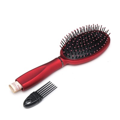 Escova de cabelo vermelha com cerdas pretas e pente preto pequeno