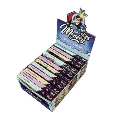 Caixa com produtos King Monkey Space Edition em embalagens coloridas com desenho de macaco astronauta.