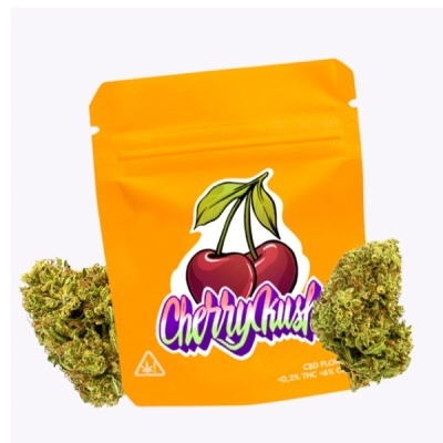 Embalagem amarela Cherry Kush com flores verdes ao lado