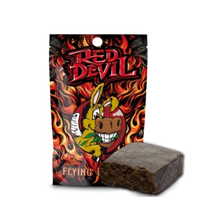 Embalagem RED DEVIL com desenho de chamas e burro sorridente, com bloco castanho escuro ao lado.