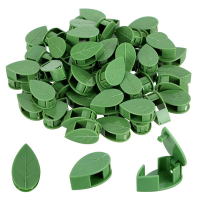 Clips plásticos verdes em forma de folha com textura de nervuras e mecanismo de abrir