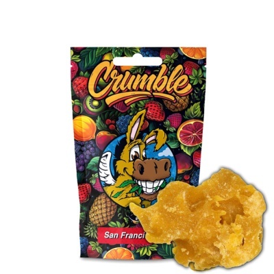 Pacote colorido com frutas e texto Crumble e pedaço de crumble dourado