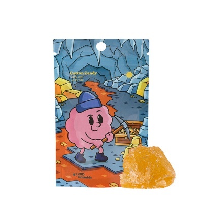 Pacote azul e laranja com personagem cor-de-rosa e pedaço amarelo de CBD Crumble