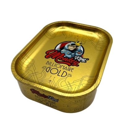 Caixa metálica dourada com desenho de macaco e texto King Monkey Billionaire Gold