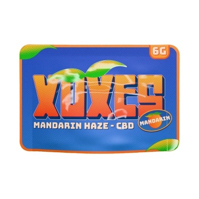 Embalagem azul com texto laranja XUXES e selo mandarin 6G