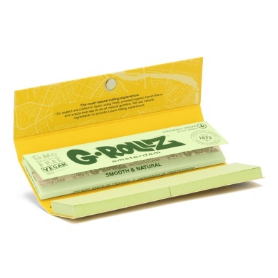 Caixa aberta de papel de seda para enrolar verde, G-Rollz Amsterdam, com embalagem amarela e texto