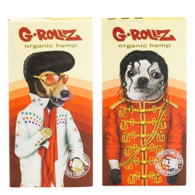 Embalagens G-Rollz com cães vestidos estilo Elvis e Michael Jackson em fundo laranja.
