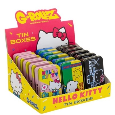Caixas de metal Hello Kitty coloridas em expositor amarelo e rosa da G-Rollz