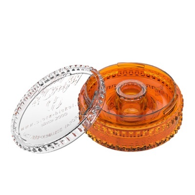 Peça circular plástica transparente e laranja com texto B-BOX e HIGH PERFORMANCE VAPOR