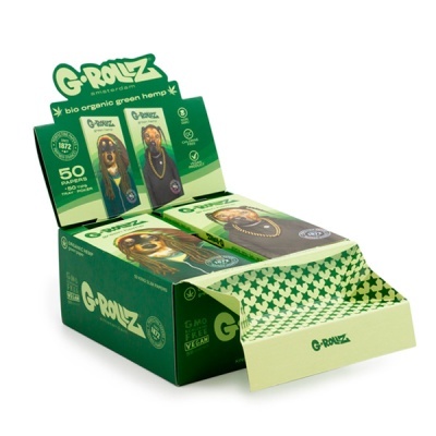 Caixa de exposição verde com pacotes de papel para enrolar G-ROLLZ em verde e imagens de cães com acessórios.