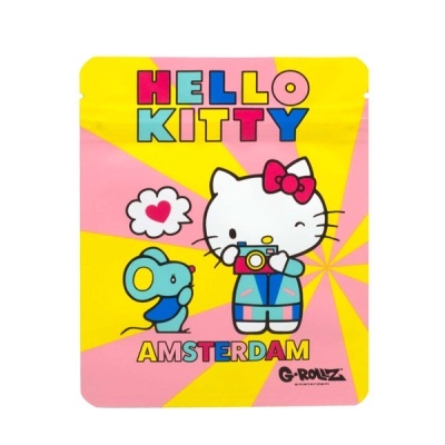 Embalagem amarela e rosa com Hello Kitty e texto colorido