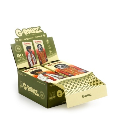 Pacotes de papel para enrolar G-ROLLZ bio organic hemp em expositor verde e bege com ilustrações de animais e texto.