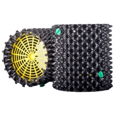 Vaso de planta preto com interior amarelo e pontos verdes