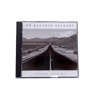 Caixa de CD com imagem de estrada deserta e texto ON BALANCE RECORDS e COUNTRY FOLK MIX