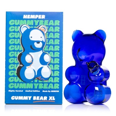 Figura urso azul translúcido e embalagem azul com texto verde e branco
