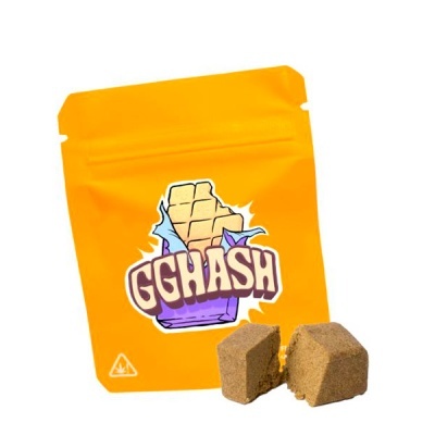 Embalagem amarela com texto GGHASH e dois cubos castanhos à frente
