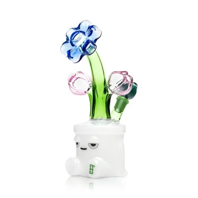 Objeto de vidro com base branca e flores coloridas em vidro