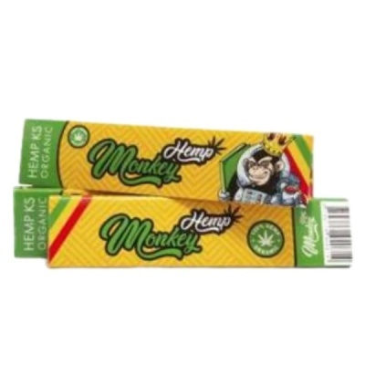 Caixas amarelas e verdes de papel para enrolar com desenho de macaco e texto Monkey Hemp