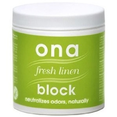 Frasco branco com etiqueta verde e texto branco ona fresh linen block.