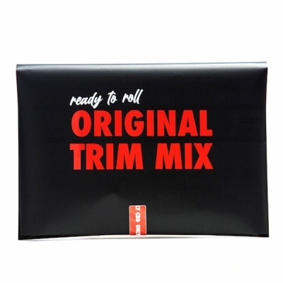 Embalagem preta com texto ORIGINAL TRIM MIX em vermelho.