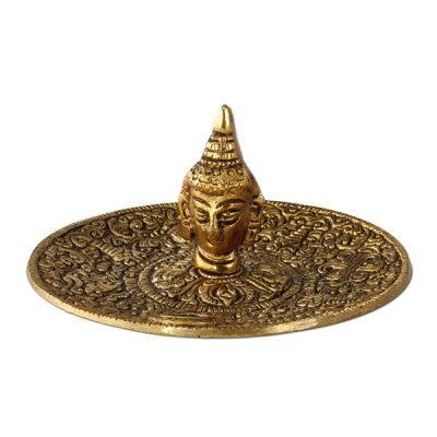 Prato decorativo dourado com cabeça escultórica ao centro