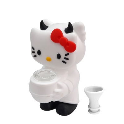 Figura branca Hello Kitty com laço vermelho e chifres negros, segurando recipiente transparente pequeno, peça branca separada ao lado.
