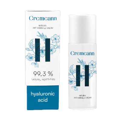 Creme anti-rugas Cremcann com ácido hialurónico em frasco branco e embalagem com flores azuis