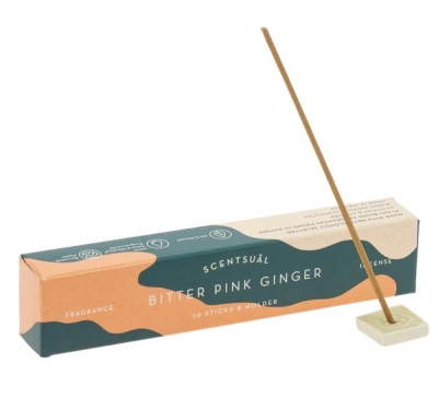 Incenso Scentsuál Bitter Pink Ginger com embalagem verde e laranja e suporte branco para incenso