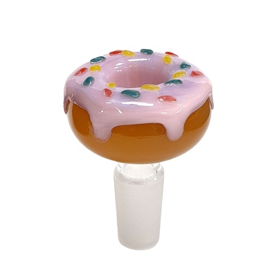 Peça de vidro em forma de donut com cobertura rosa e granulado colorido