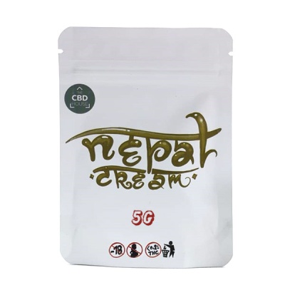 Embala branca Nepal Dream 5g com texto dourado e símbolos de advertência