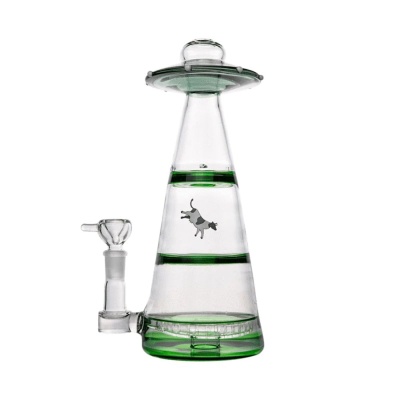 Base de vidro transparente com detalhes verdes e uma figura de vaca