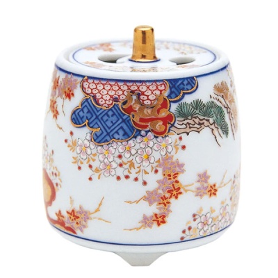Incensário cerâmico branco com padrão floral colorido e detalhes dourados